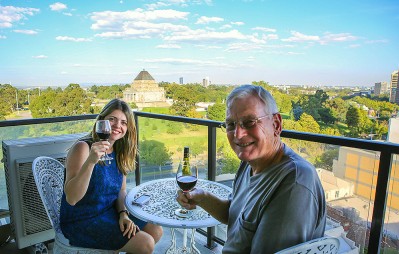 Melbourne by the Botanical Gardens Father and wife enjoy a red on the balcony.